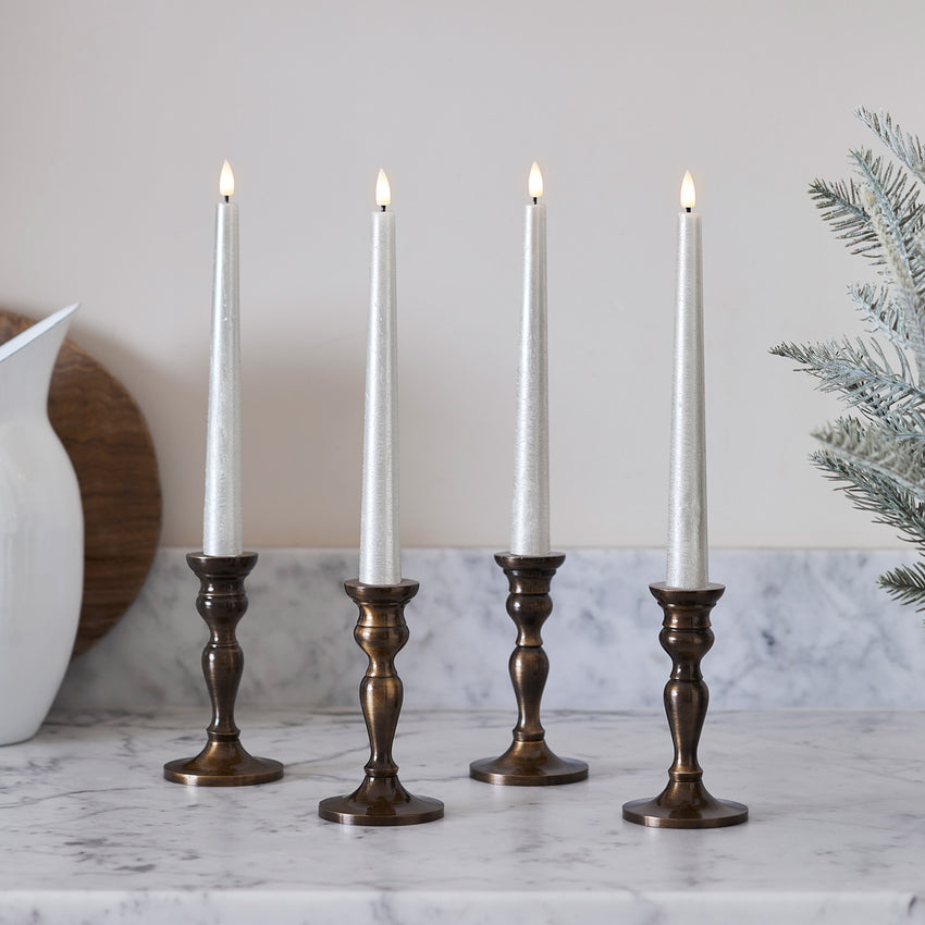 Champagne LED taper candles in kitchen