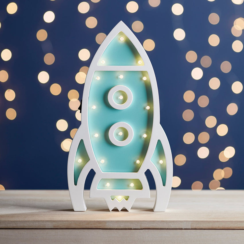 Children's rocket light on night sky background