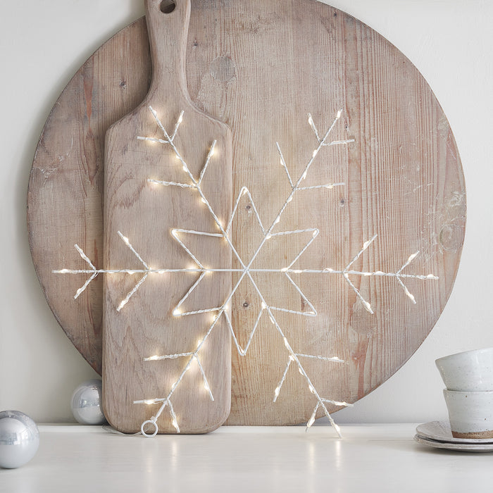 3 LED snowflake decorations on a tree