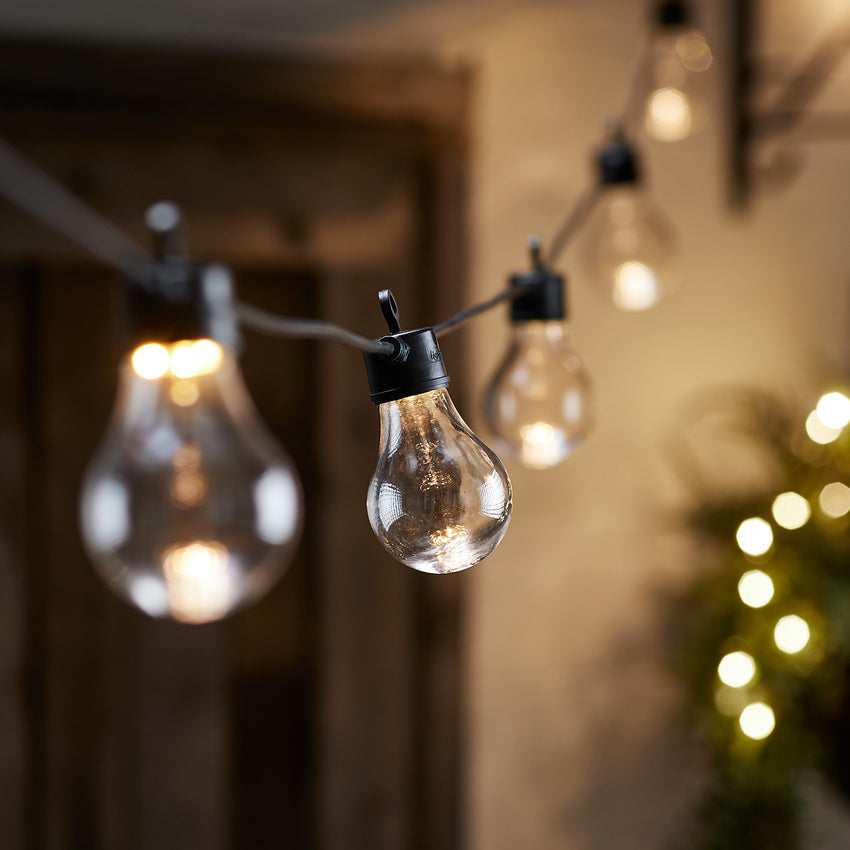 Black core connect festoon lights hung outdoors