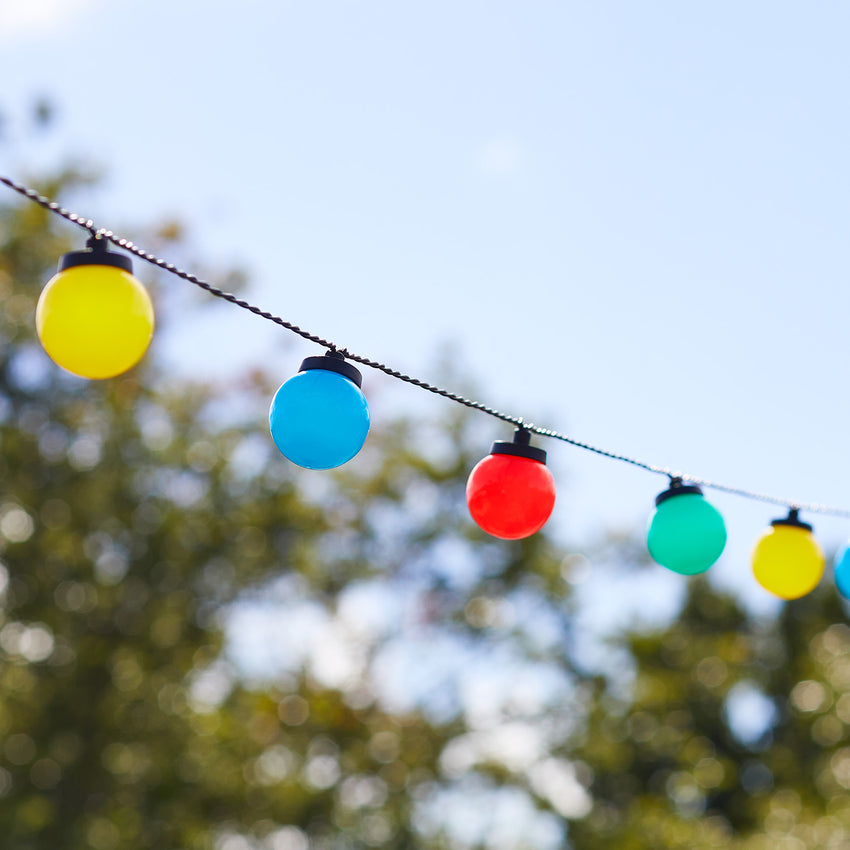 Multi coloured festoon lights outdoor setting