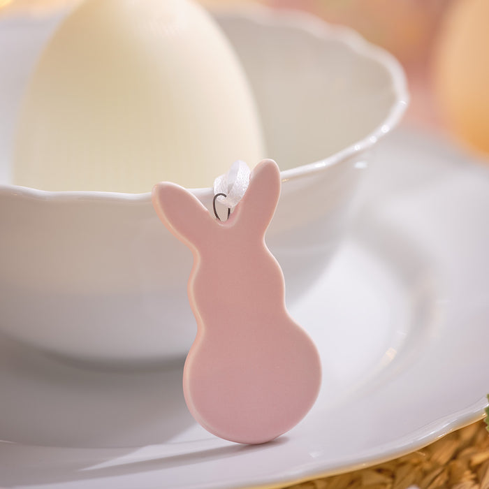 Pastel ceramic bunny decoration on a dinner plate