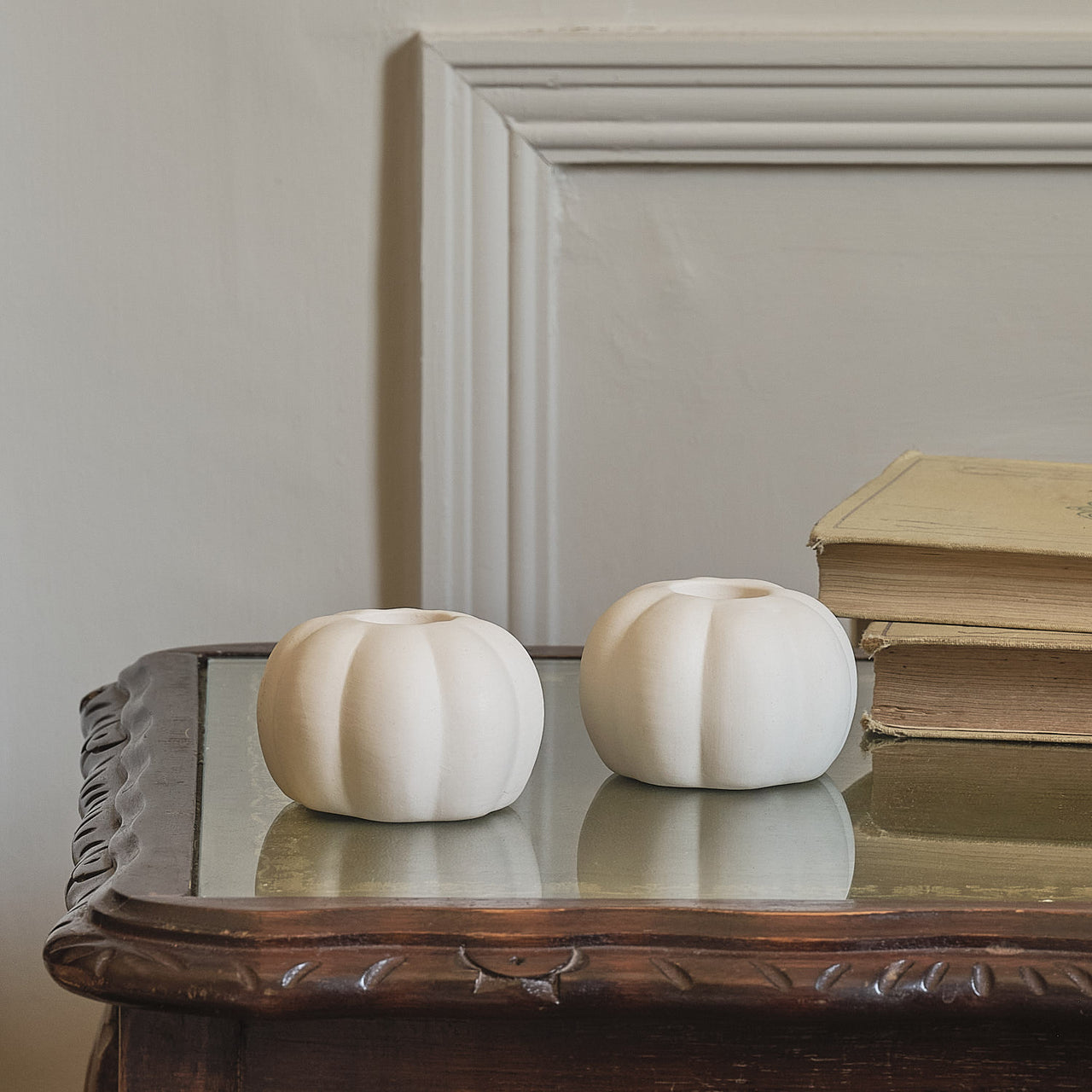 Set of 4 TruGlow® Ivory LED Taper Candles and Matte White Ceramic Pumpkin Taper Candle Holders