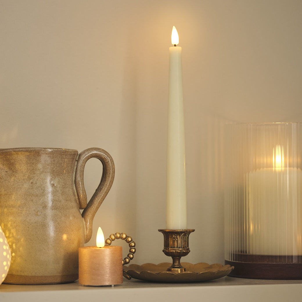 LED candles on a kitchen shelf