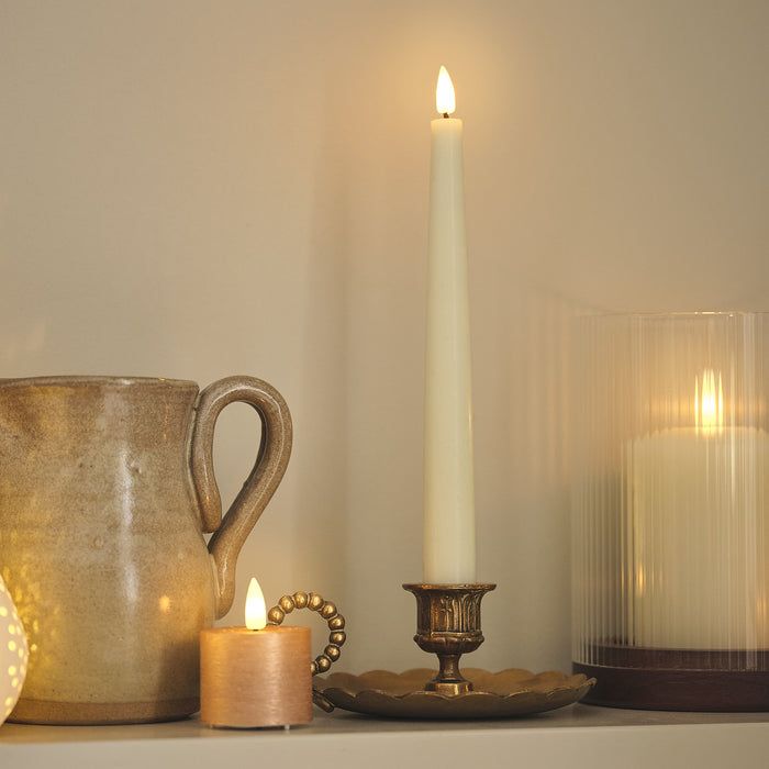 LED candles on a kitchen shelf