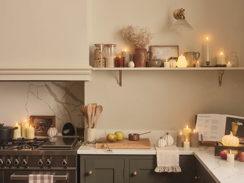 Kitchen decorated with LED candles and pumpkins