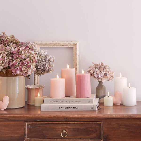 Close-up-pastel-dresser-decorations-pink-candles-floral_600x600_728f04ac-df19-4123-a94e-46ab0491723b.jpg