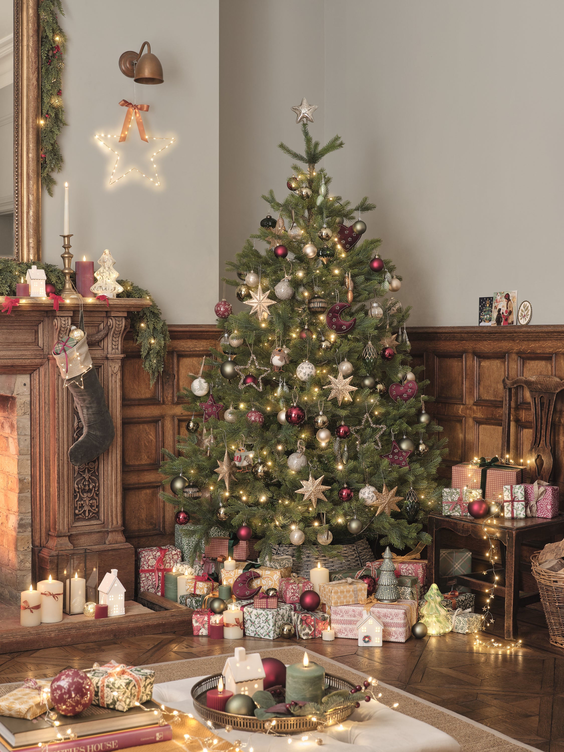 Christmas tree decorated with traditional lights, decorations, and candles