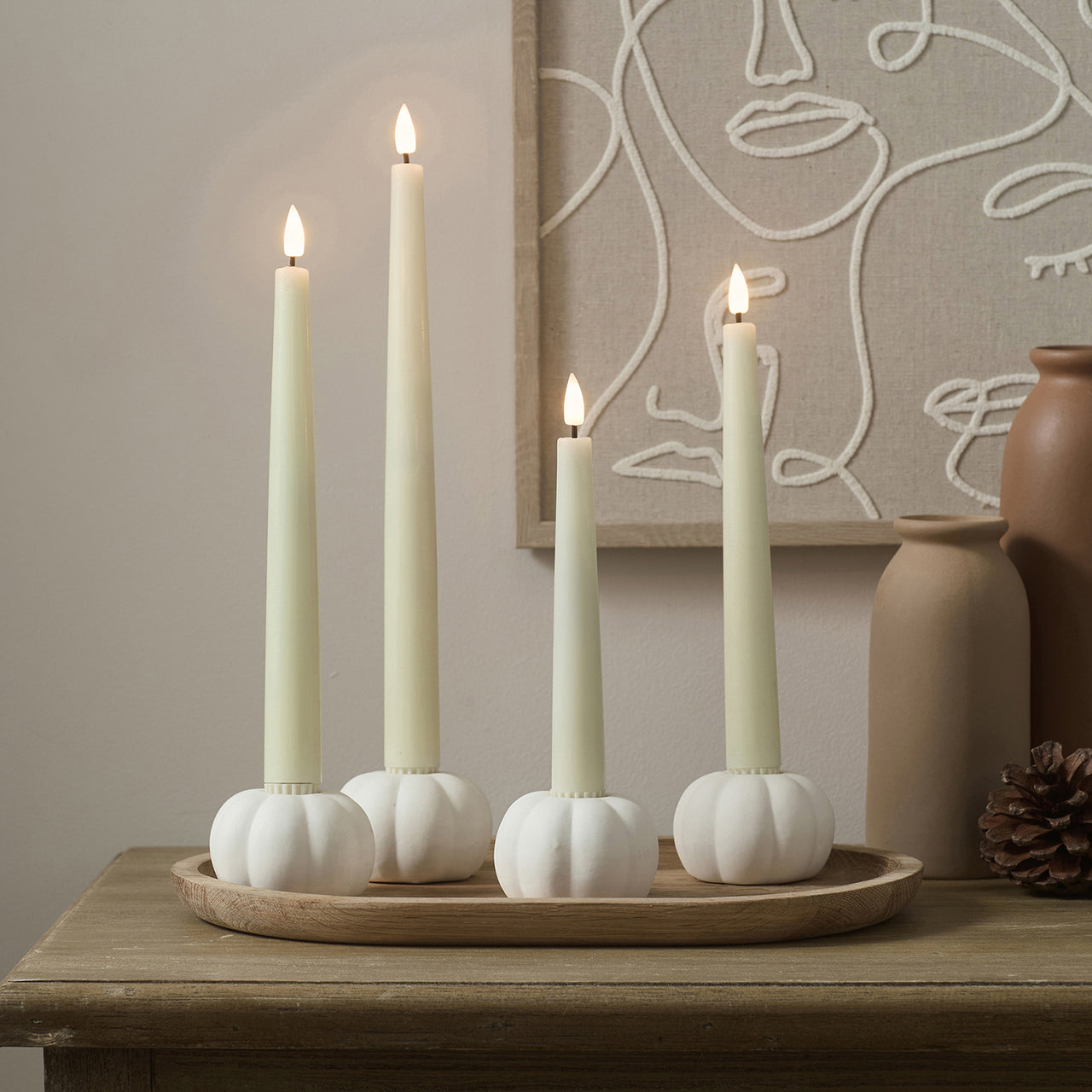 Set of 4 TruGlow® Ivory LED Taper Candles and Matte White Ceramic Pumpkin Taper Candle Holders