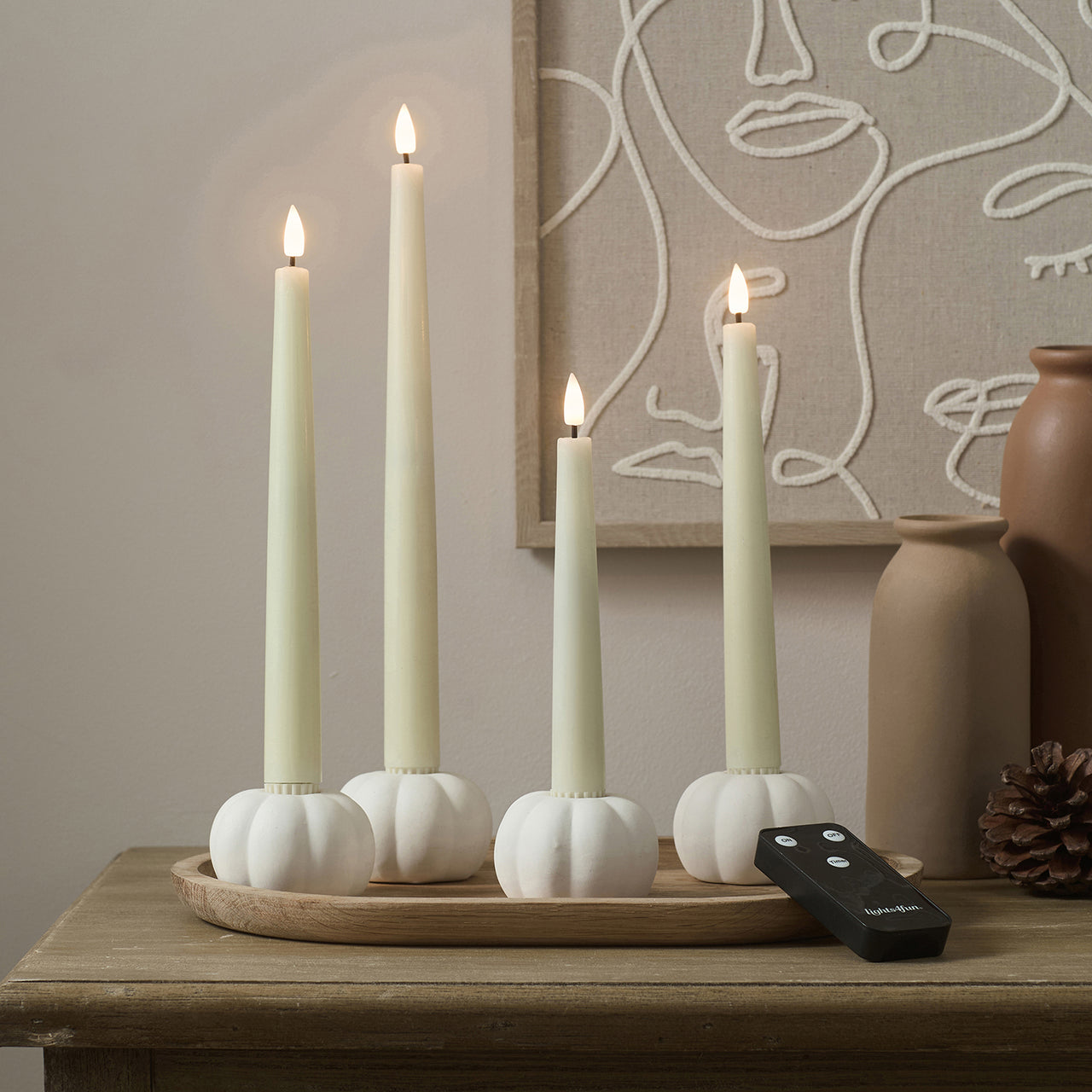 Set of 4 TruGlow® Ivory LED Taper Candles and Matte White Ceramic Pumpkin Taper Candle Holders