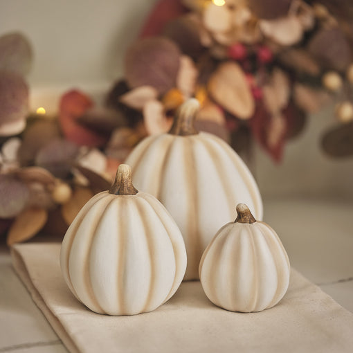 Trio of white pumpkin decorations