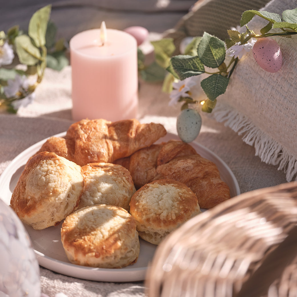 Plate of pastries on a picnic blanket