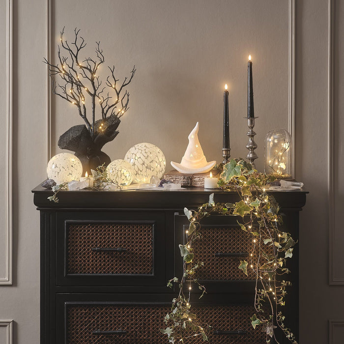 Sideboard styled with LED candles and Halloween decorations