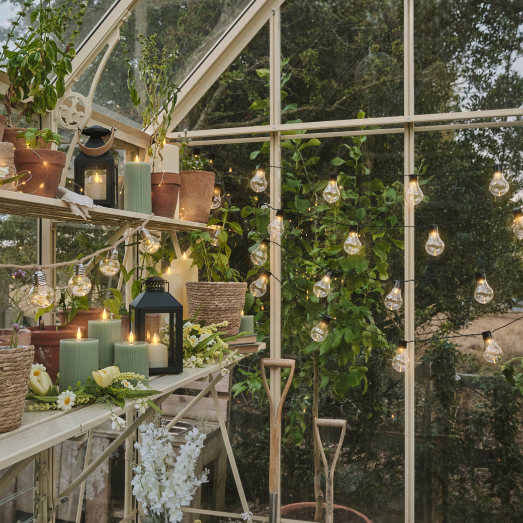 Festoon lights hung up in a greenhouse