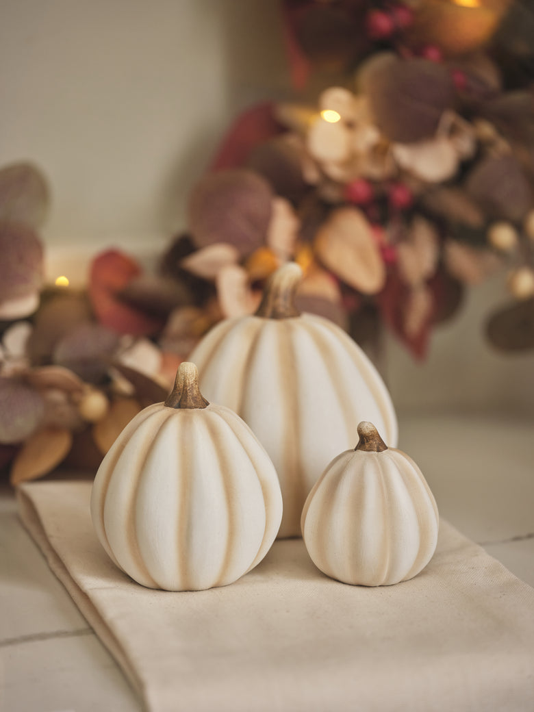 Trio of white pumpkin decorations
