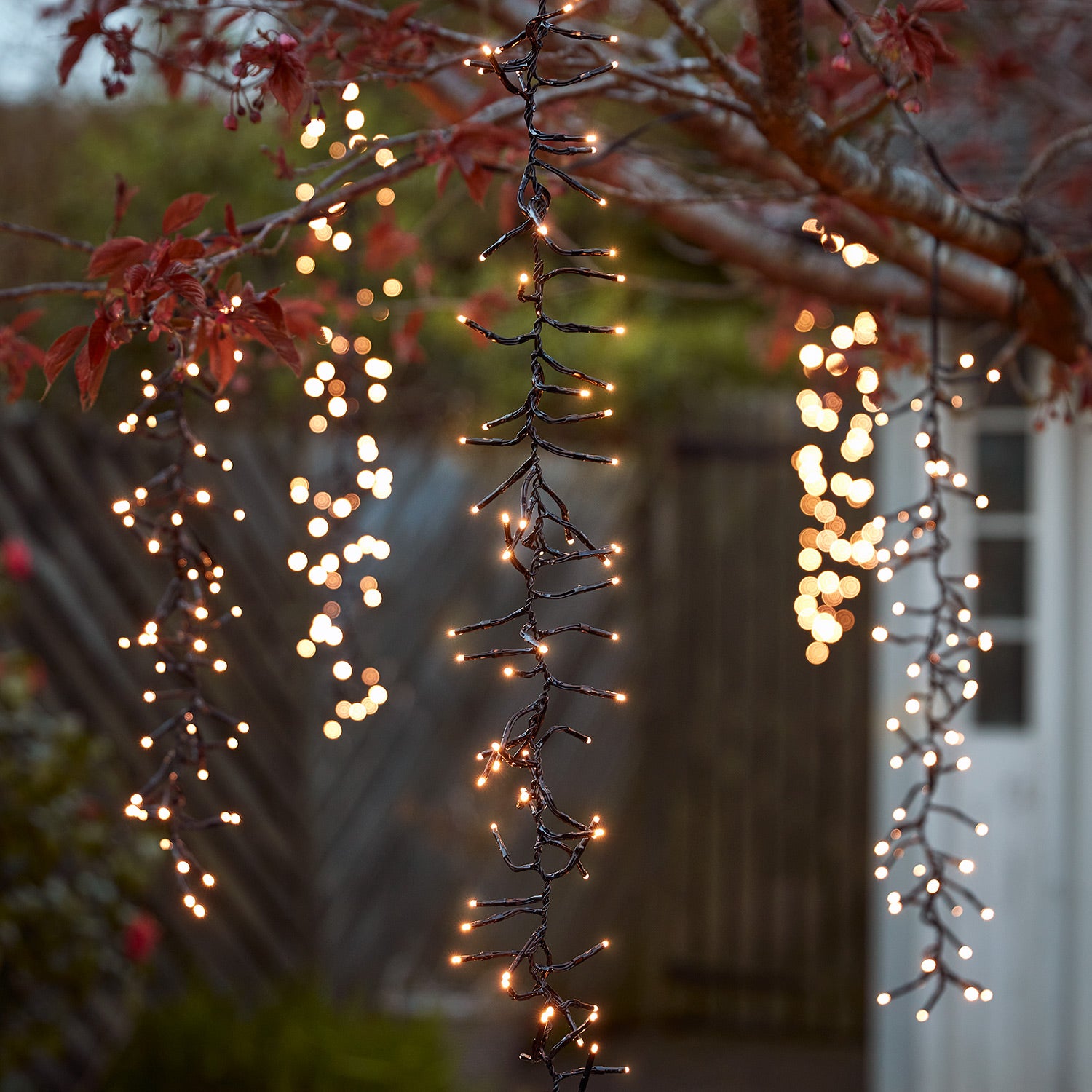 6 Warm White Cascading Outdoor Cluster Lights Lights4fun.co.uk