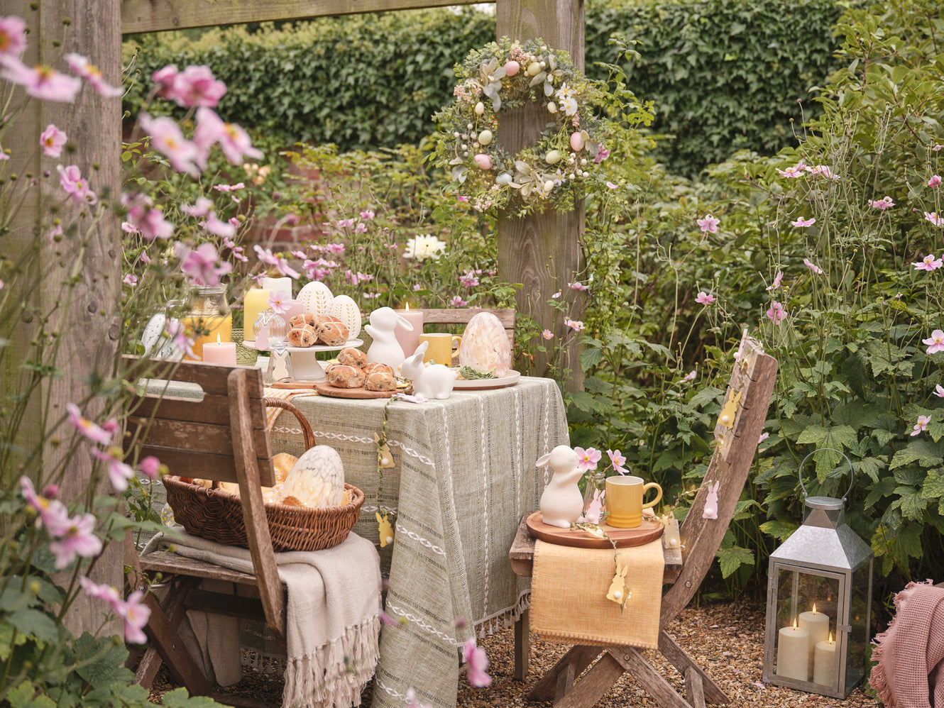 Outdoor table with porcelain bunny and glass egg decorations 