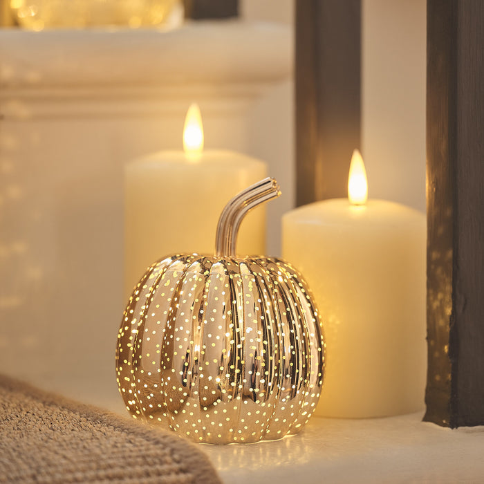 Brass light up pumpkin decoration with LED candles