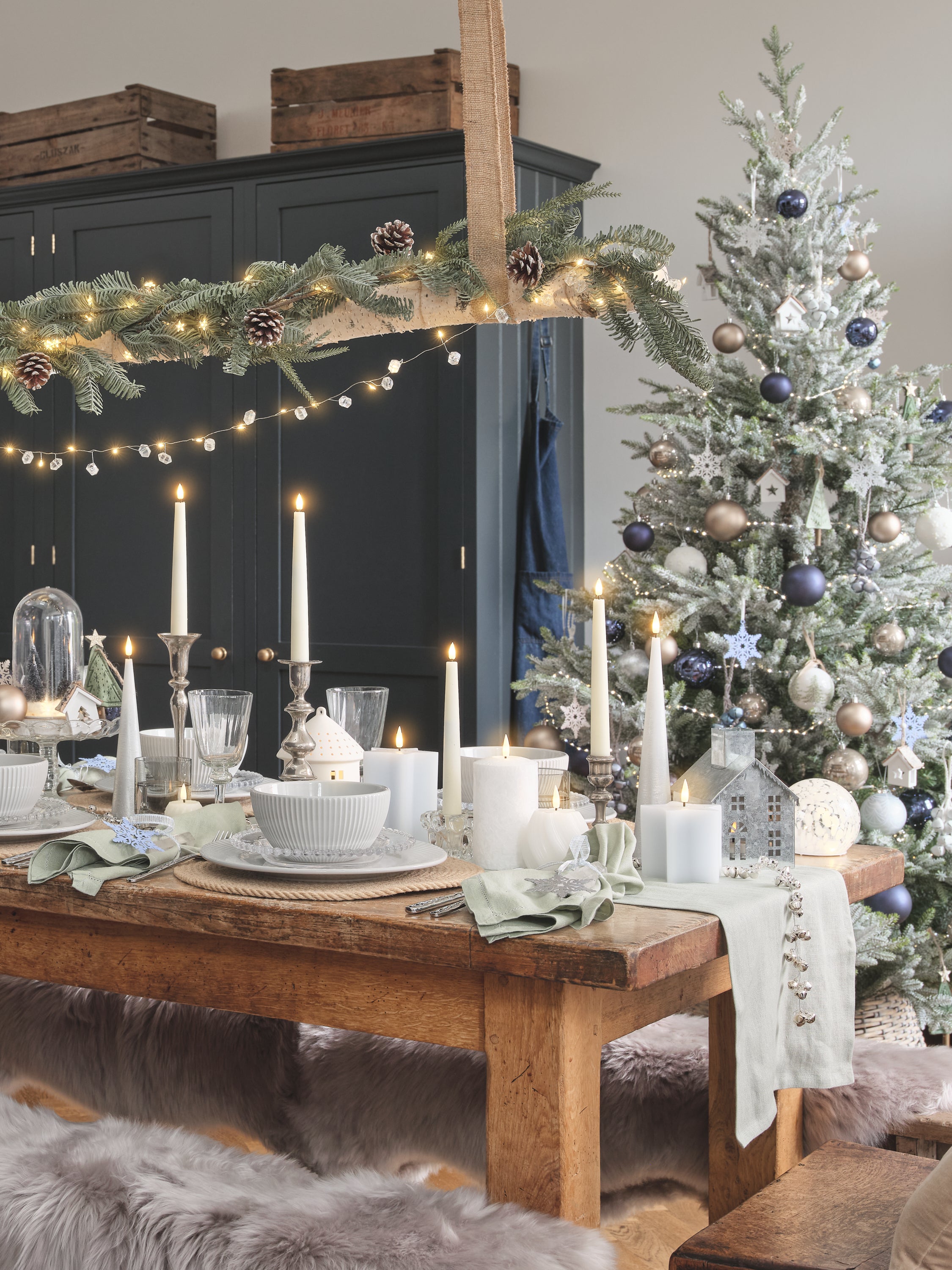 Dining table decorated with celestial themed lighting and decorations