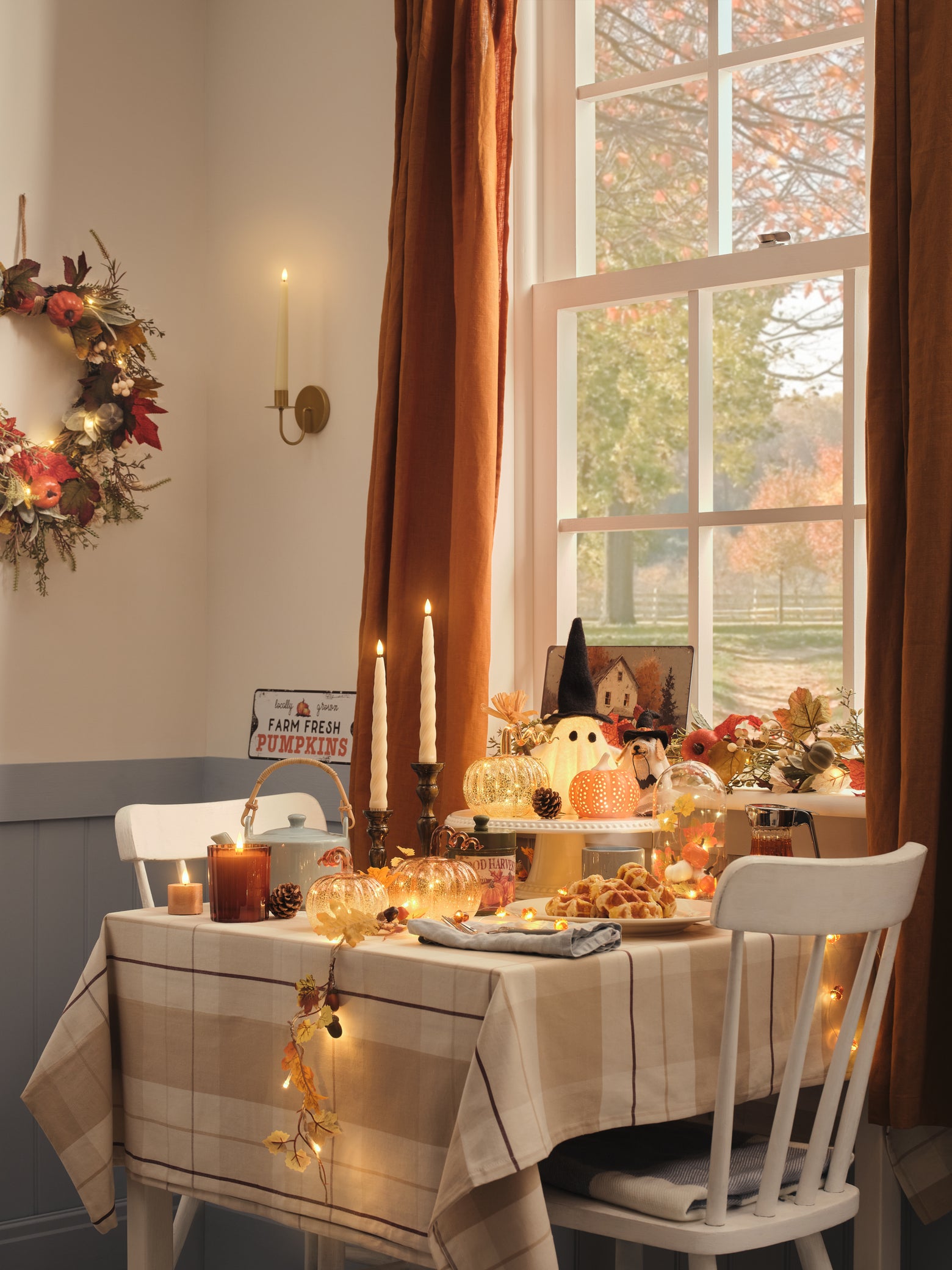Table decorated with Halloween and autumnal decorations