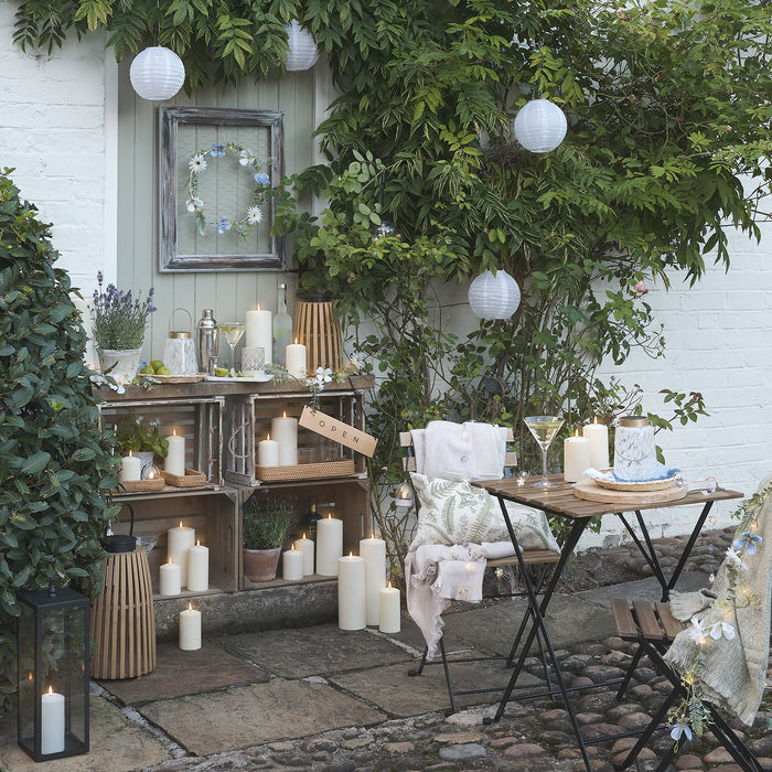 Outdoor bistro area with LED candles and lanterns