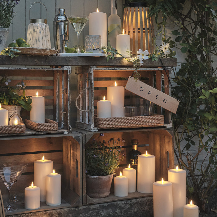 Garden shelves with LED candles and lanterns
