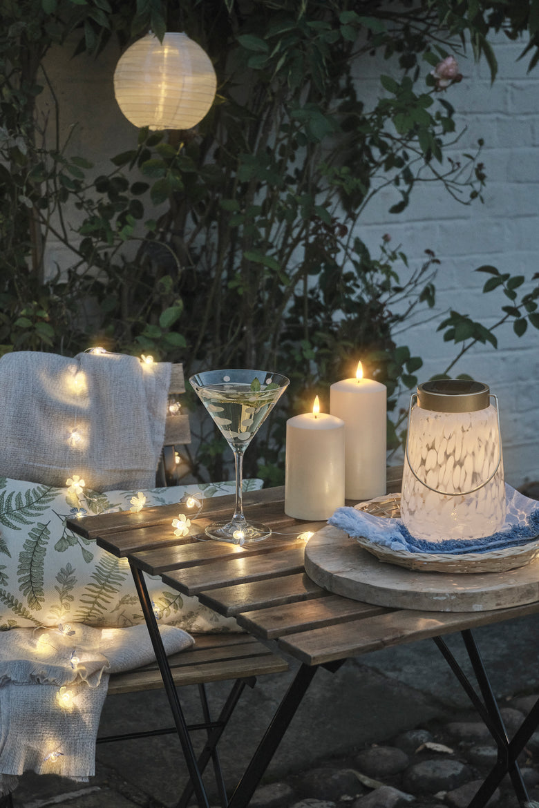Outdoor table with LED candles and lanterns