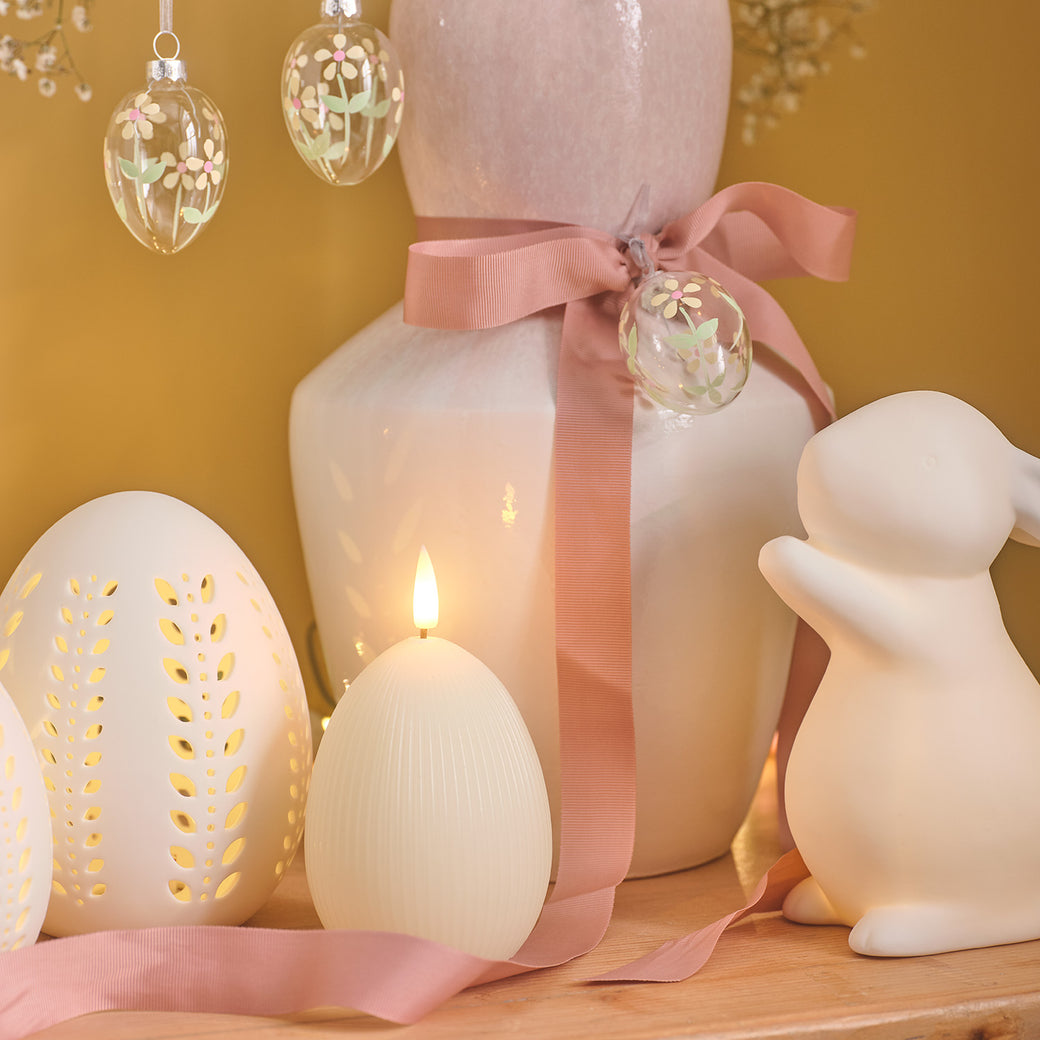 Porcelain egg and bunny decorations with an egg LED candle and vase 