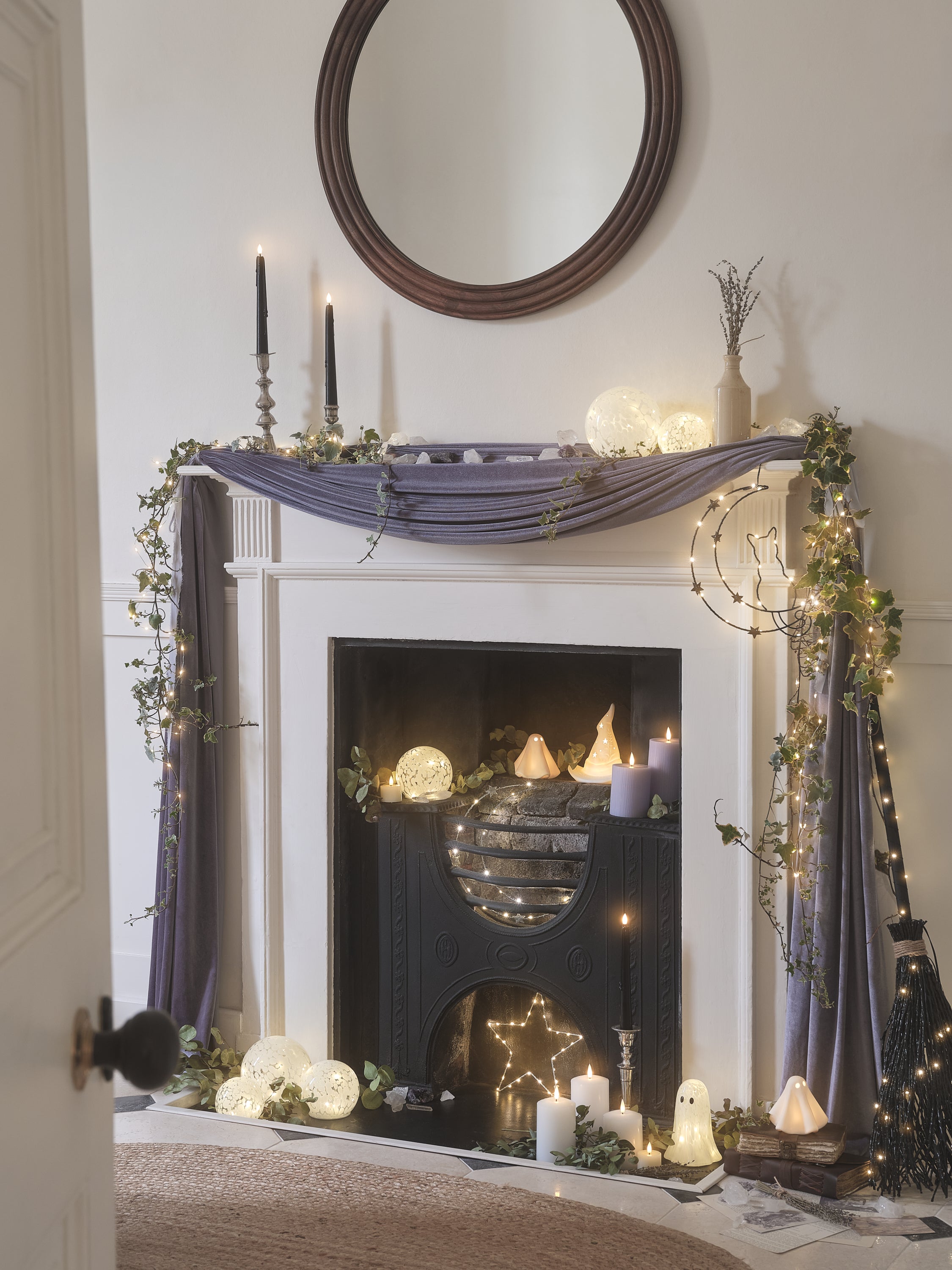 Fireplace decorated with LED candles and ghost decorations