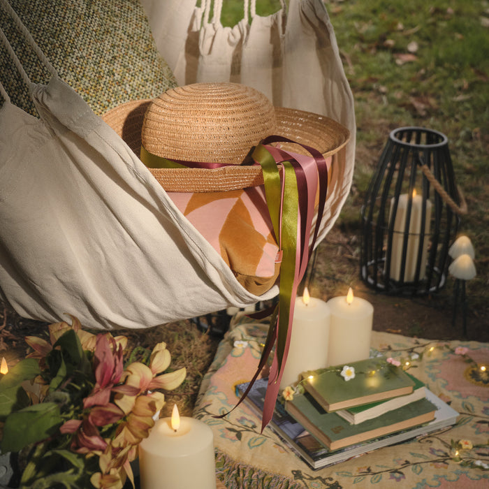 Hanging garden chair with summer hat