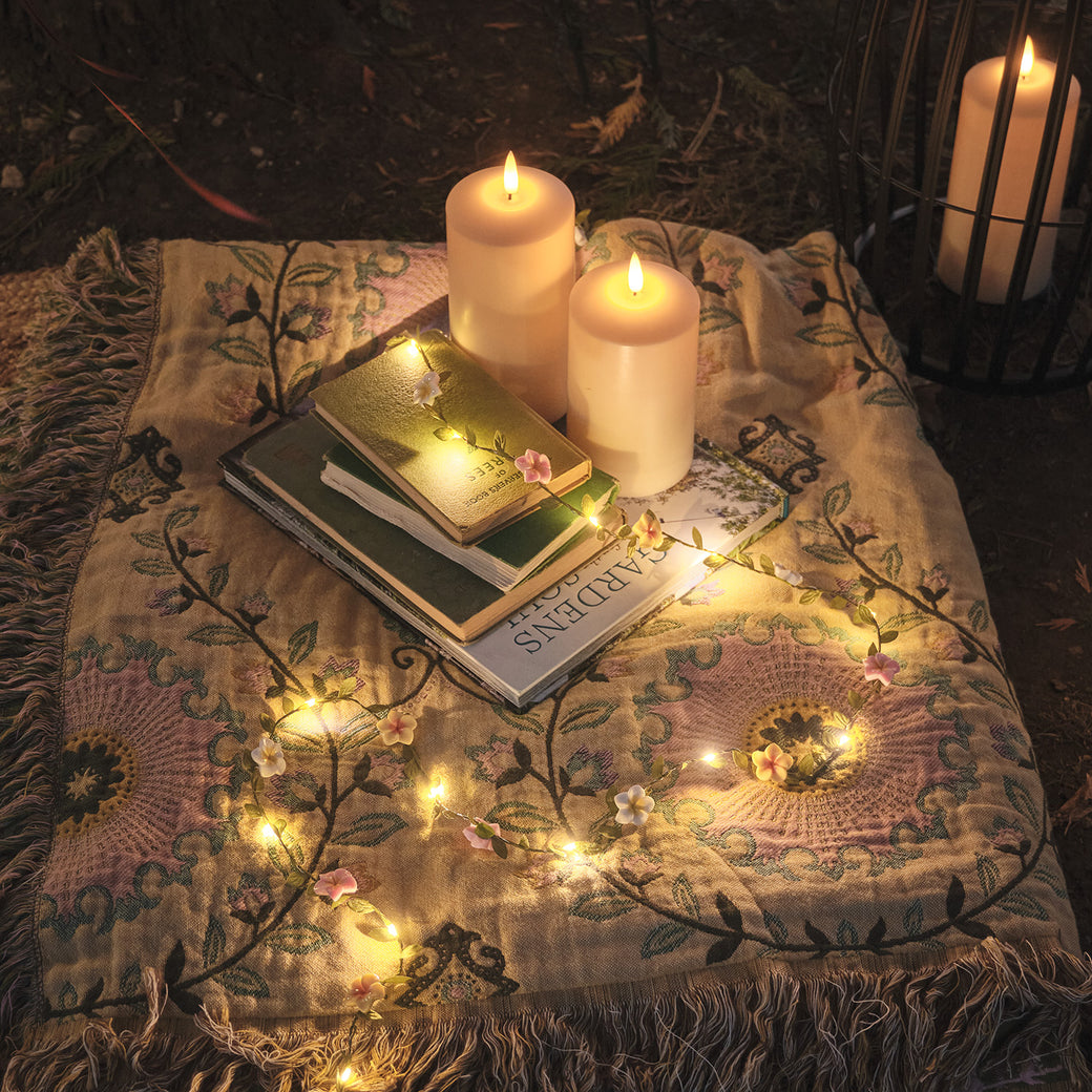 LED candles and garland on a festival blanket