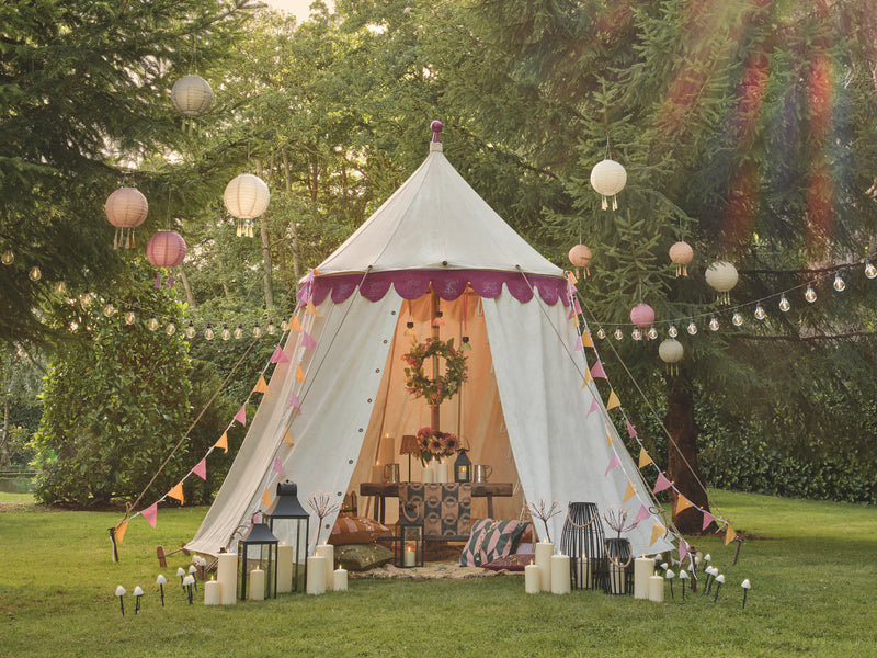 A festival tent with lanterns and LED candles