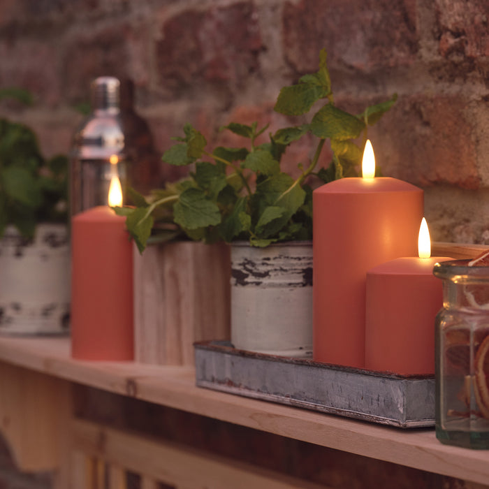Terracotta LED candles on garden shelves