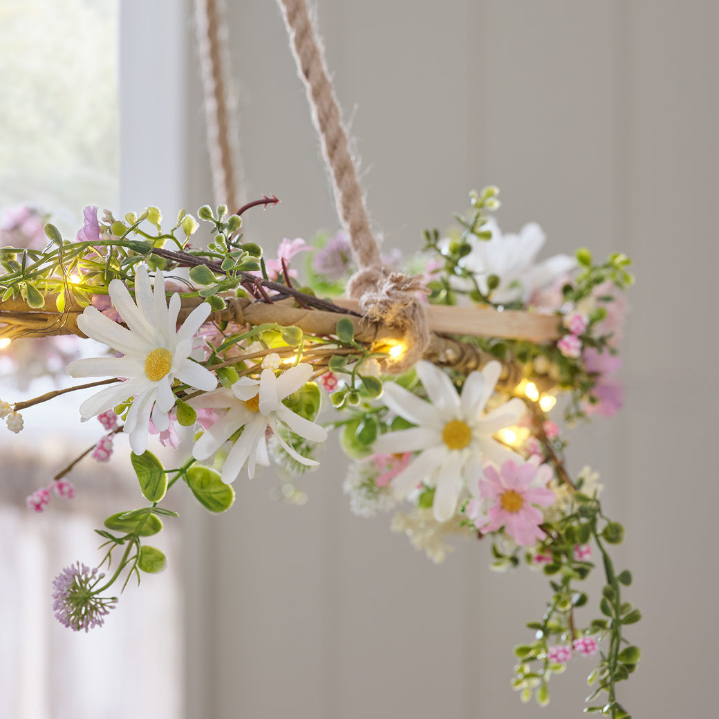 A daisy garland wrapped around a hanging decoration
